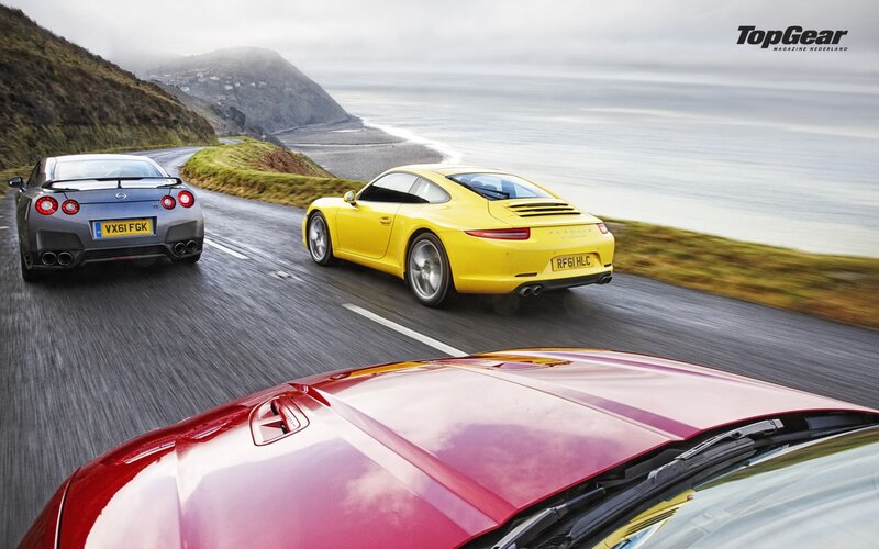 Sports Cars on Coastal Road — Yellow