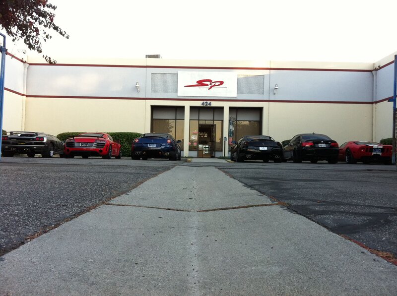 sports cars outside a building
