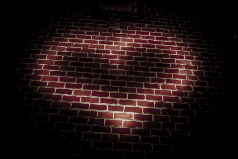 spotlit brick wall