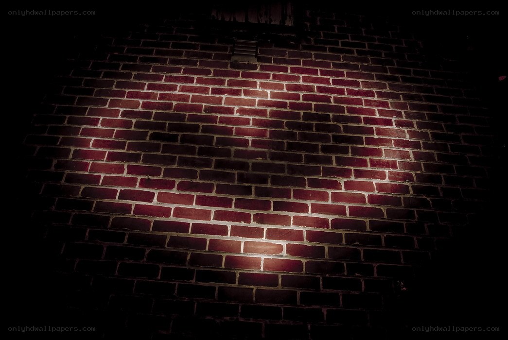 spotlit brick wall