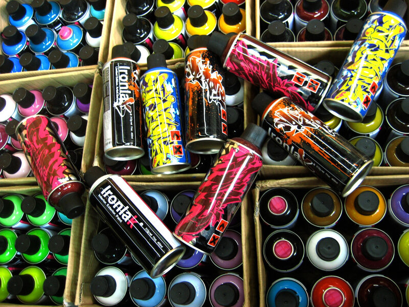 Spray paint cans in boxes