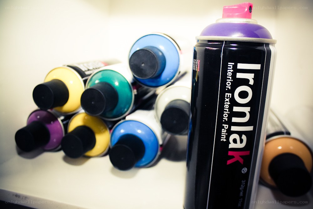 spray paint cans on shelf