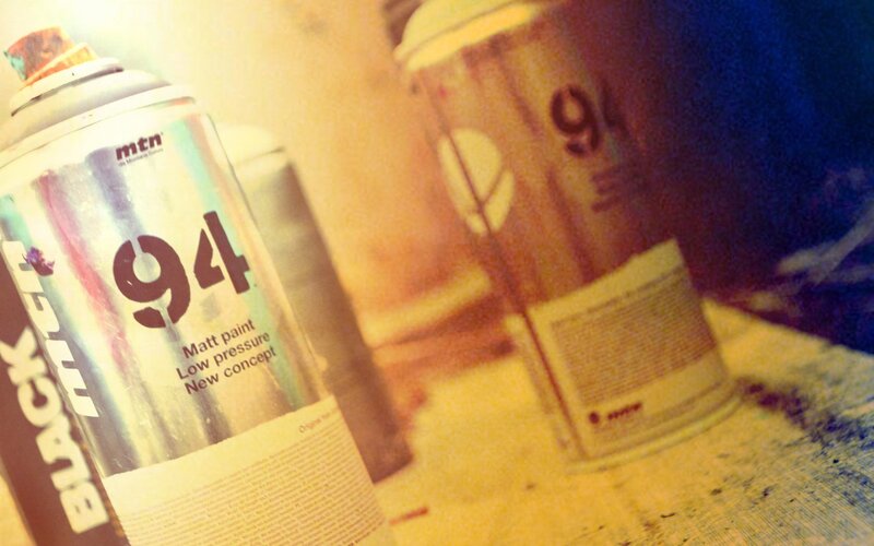 spray paint cans on table