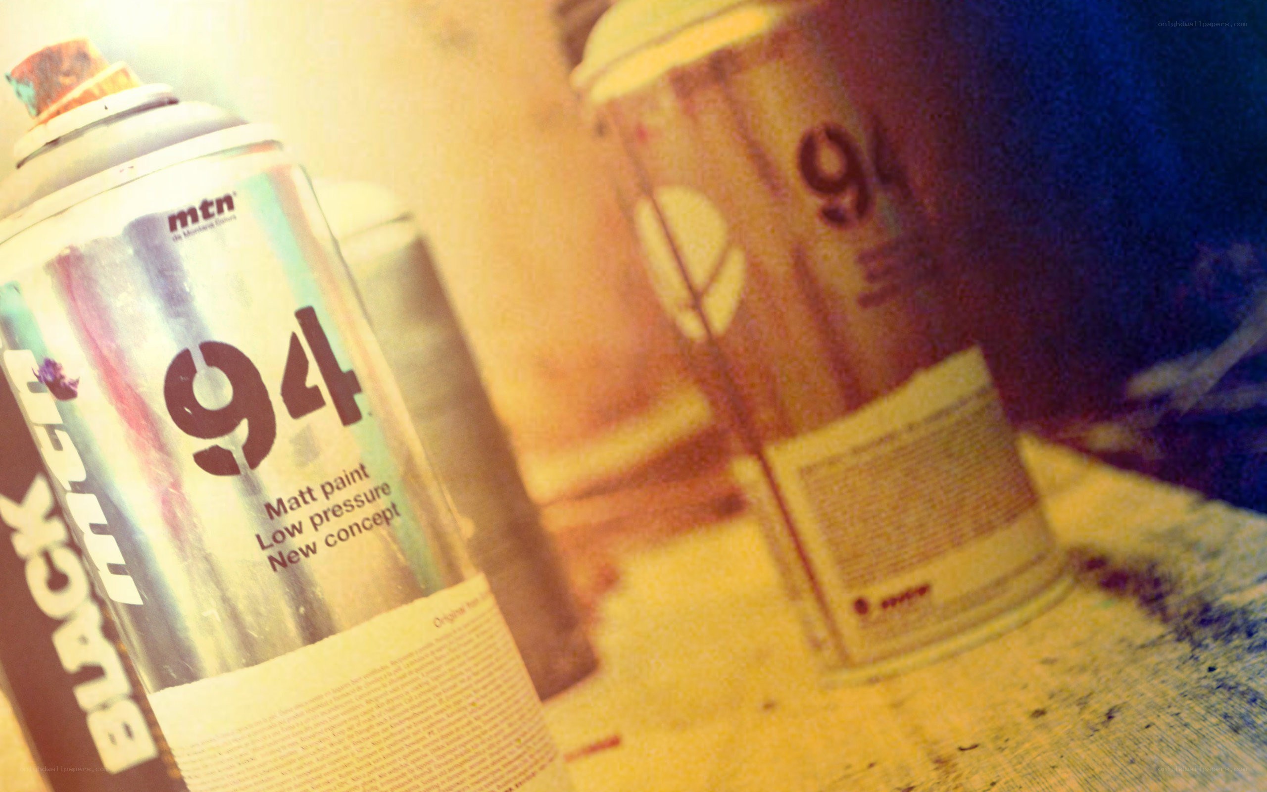 spray paint cans on table