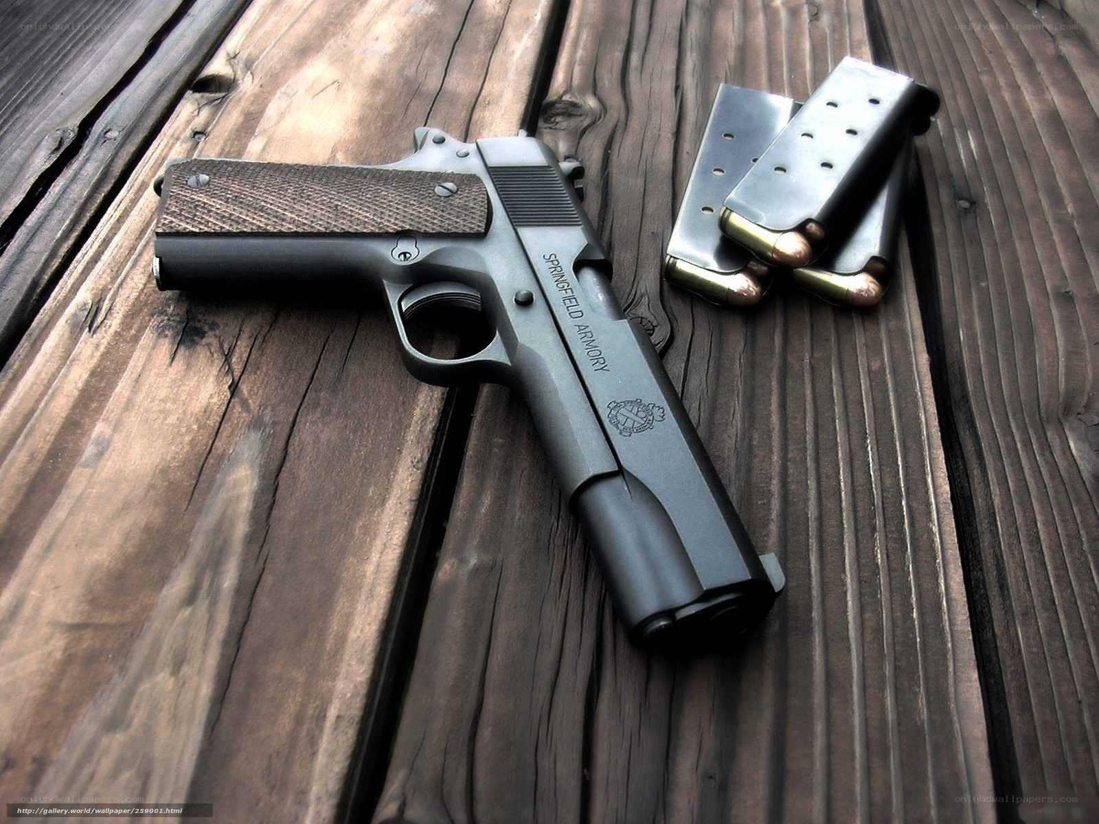 Springfield pistol on wood