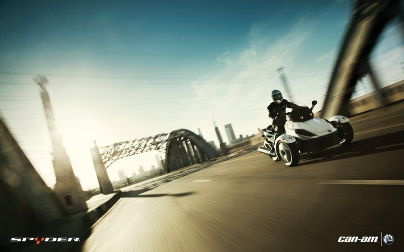 Spyder on a city bridge