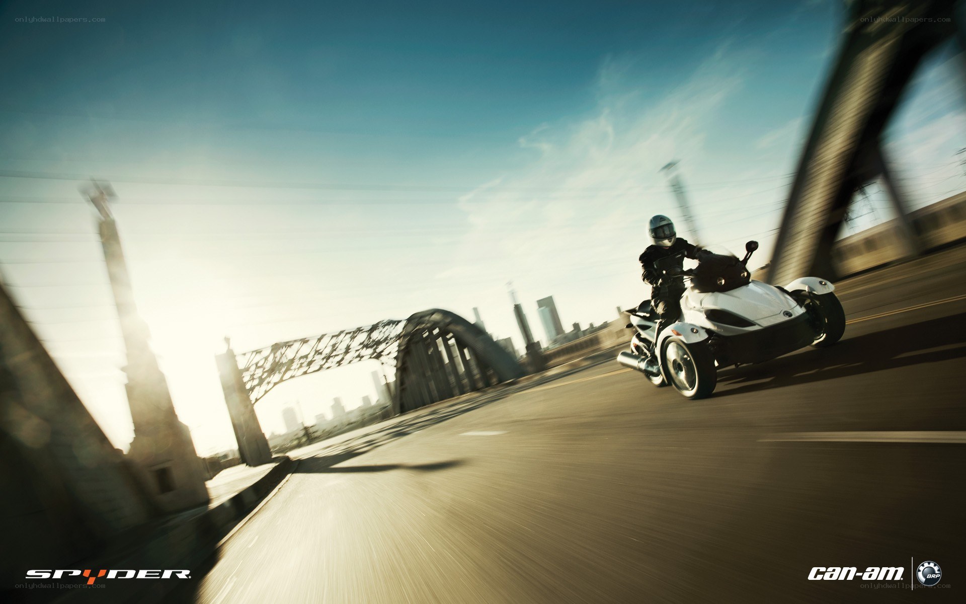 Spyder on a city bridge