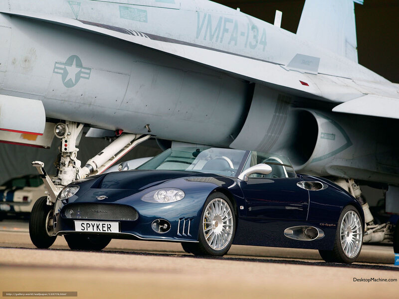 Spyker C8 in front of fighter jet