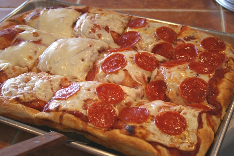 Square pepperoni pizza on tray