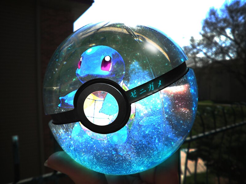 Squirtle in a glowing Poké Ball
