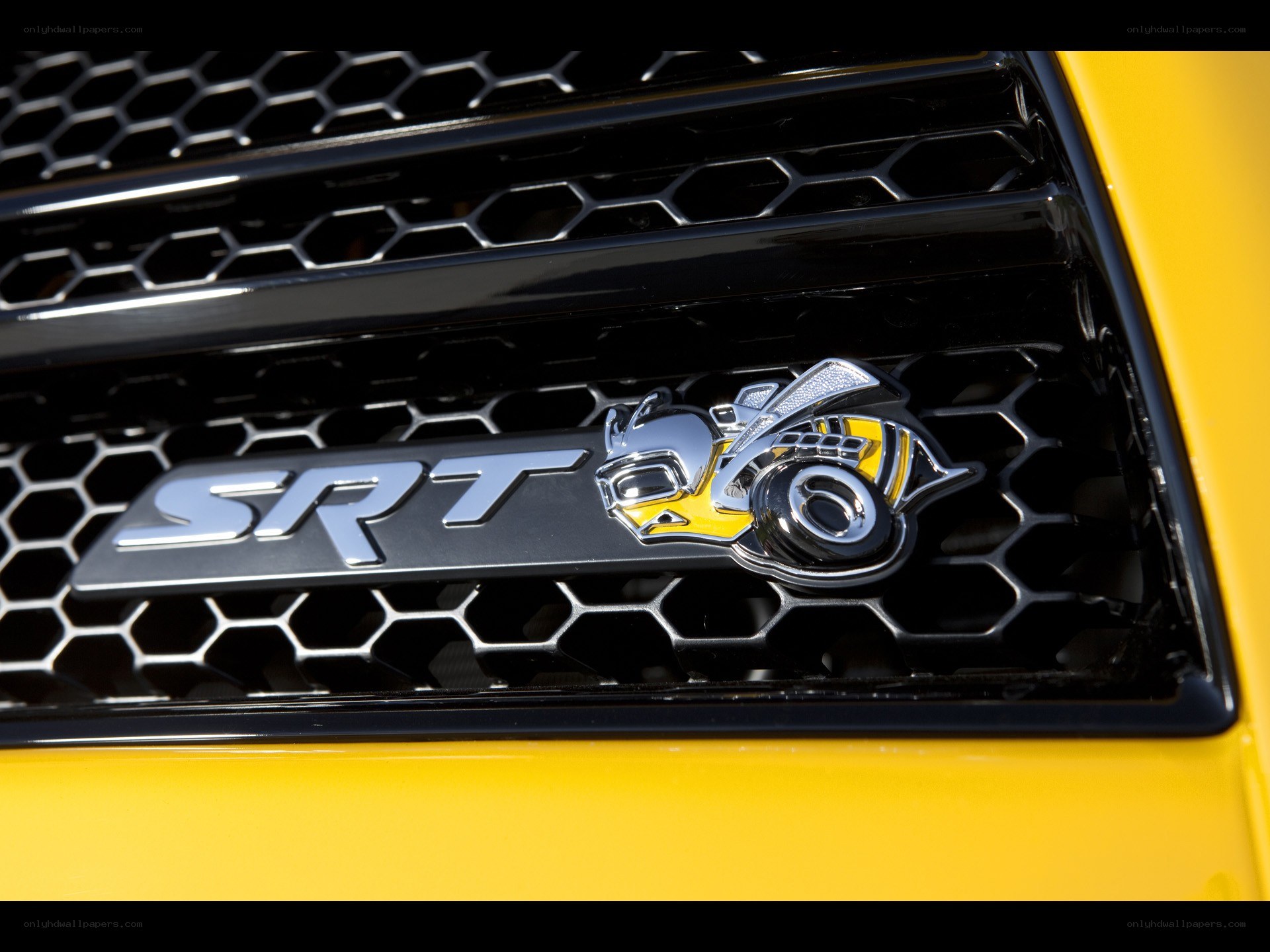 SRT badge on yellow car