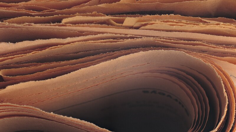 stack of aged paper sheets