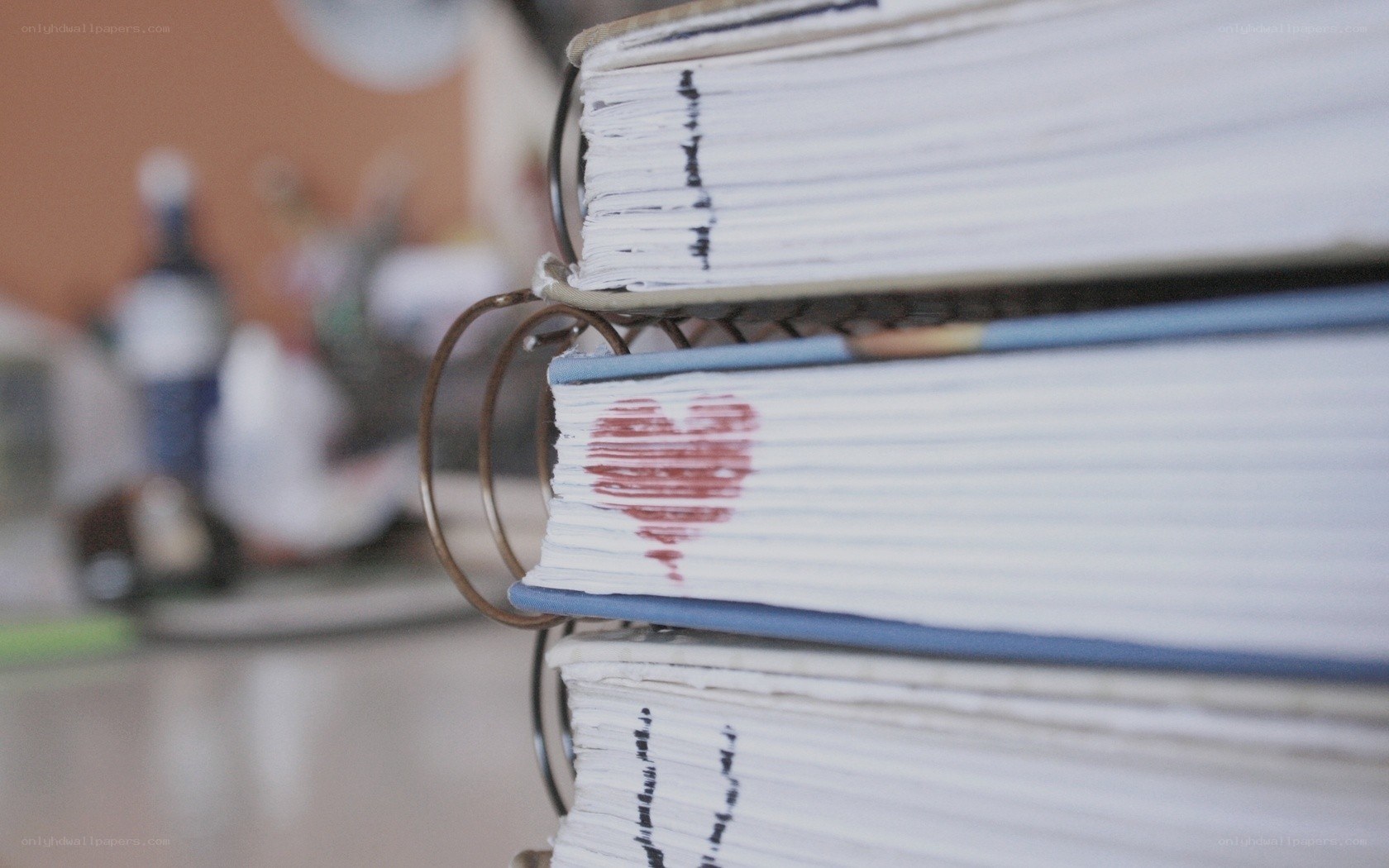 stack of binders with heart stamp