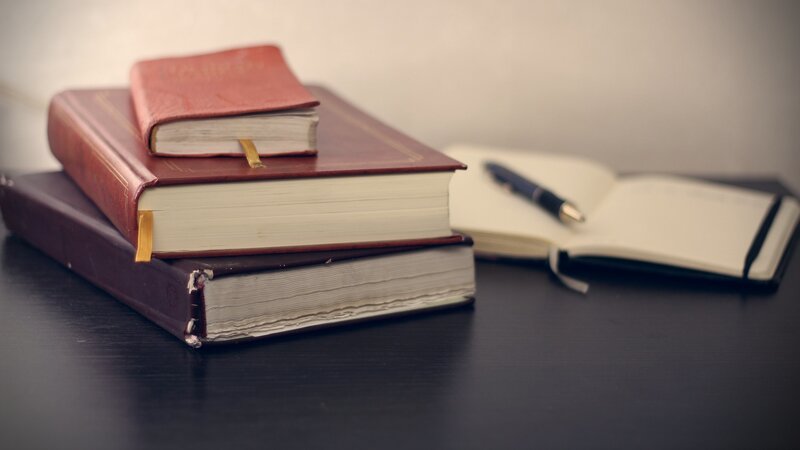 Stack of Books and Notebook