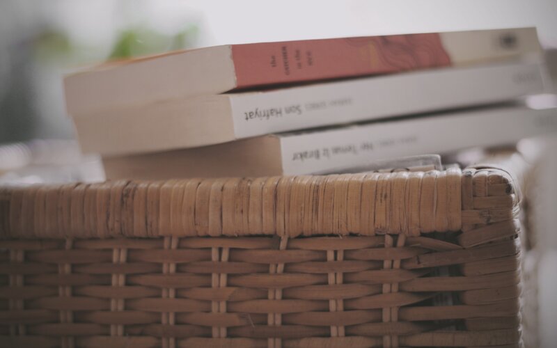 Stack of Books in Basket