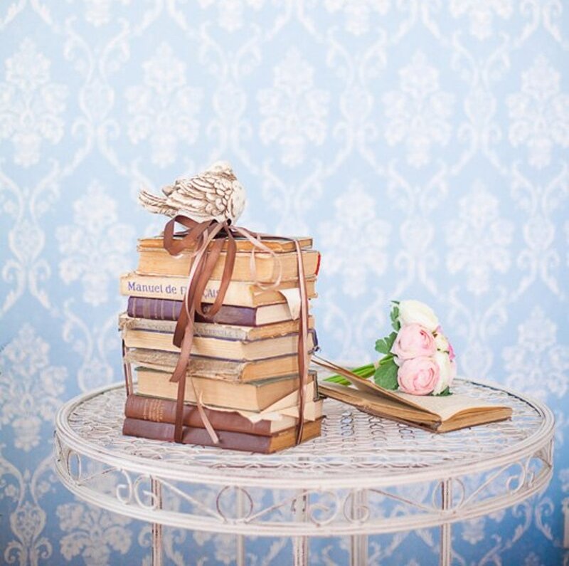 Stack of Books with Bird