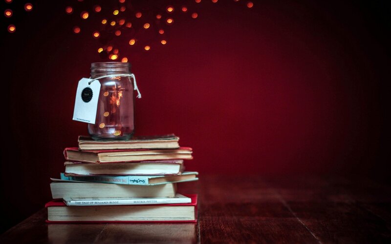 Stack of Books with Jar