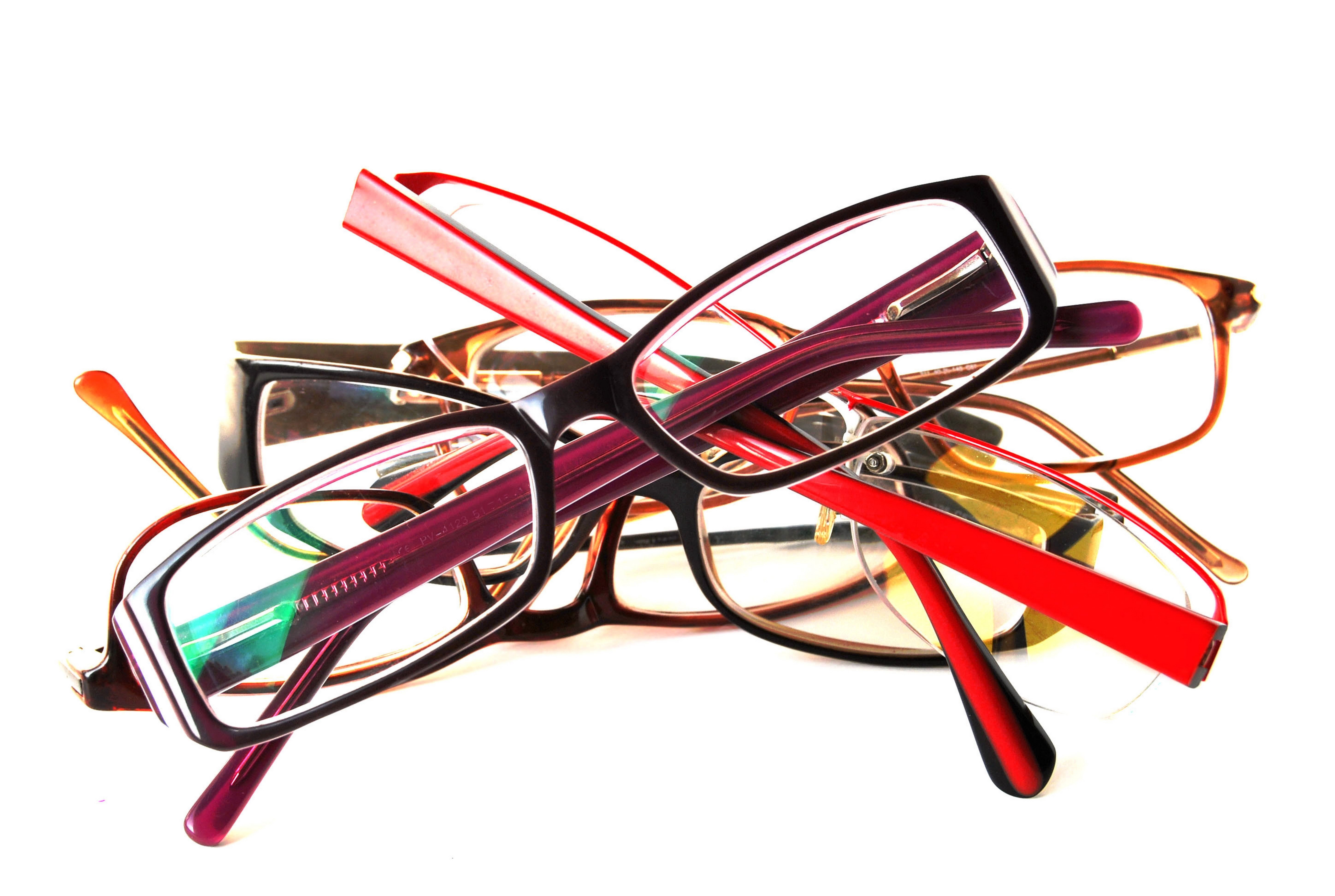 stack of colorful eyeglasses