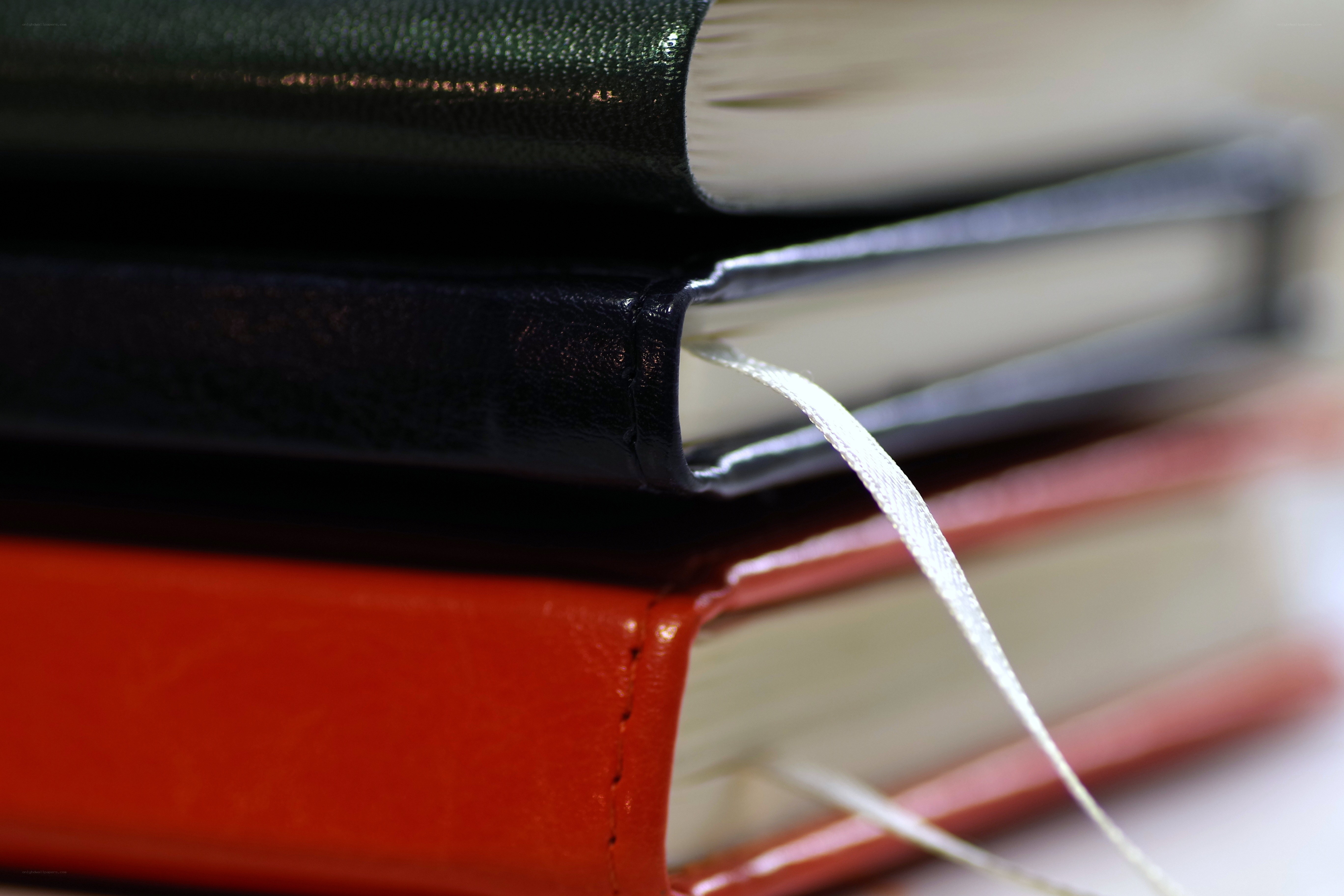 stack of colorful journals