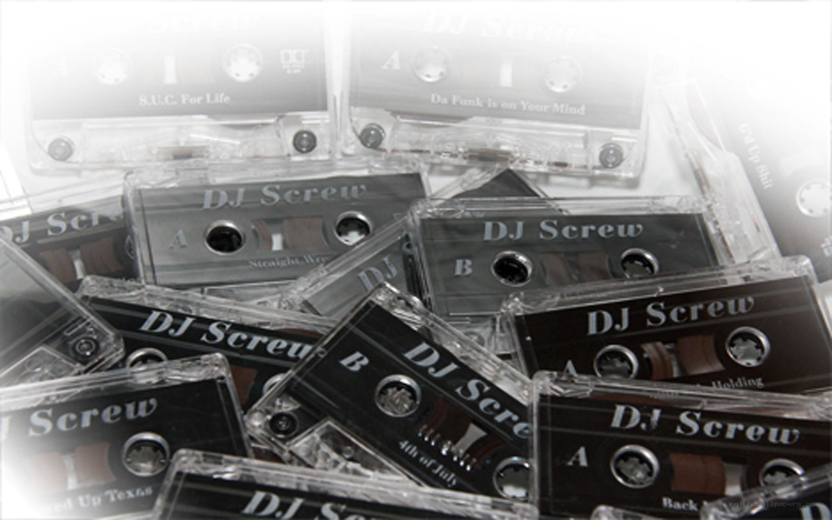 stack of dj screw cassettes