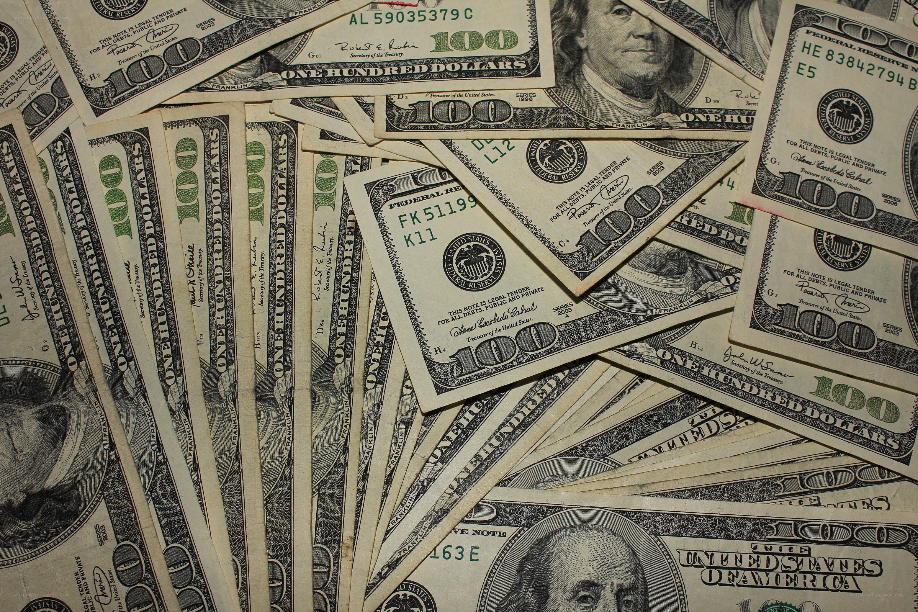 stack of hundred dollar bills