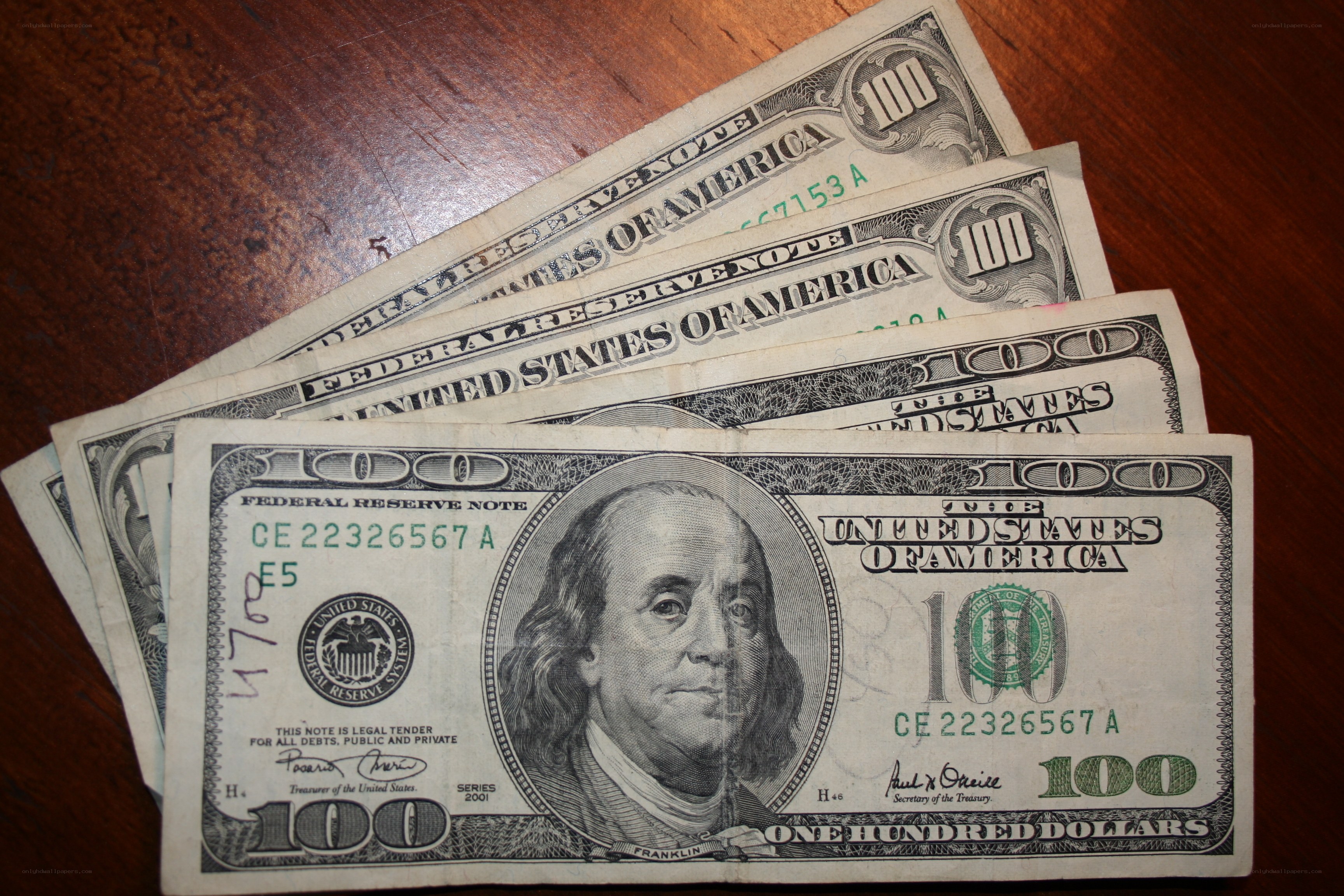 stack of hundred-dollar bills