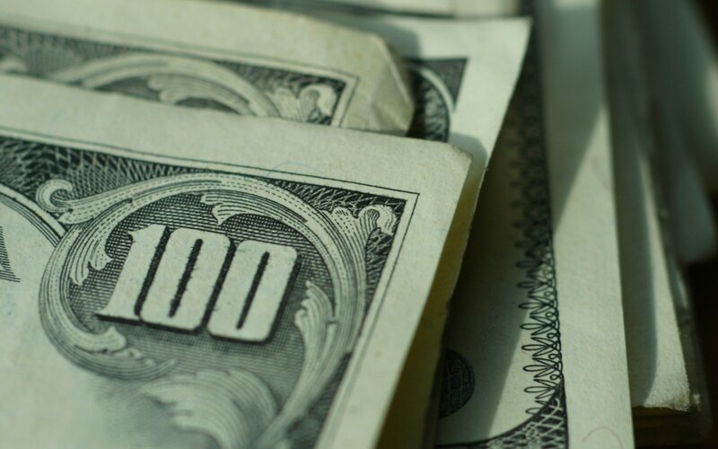 stack of hundred dollar bills