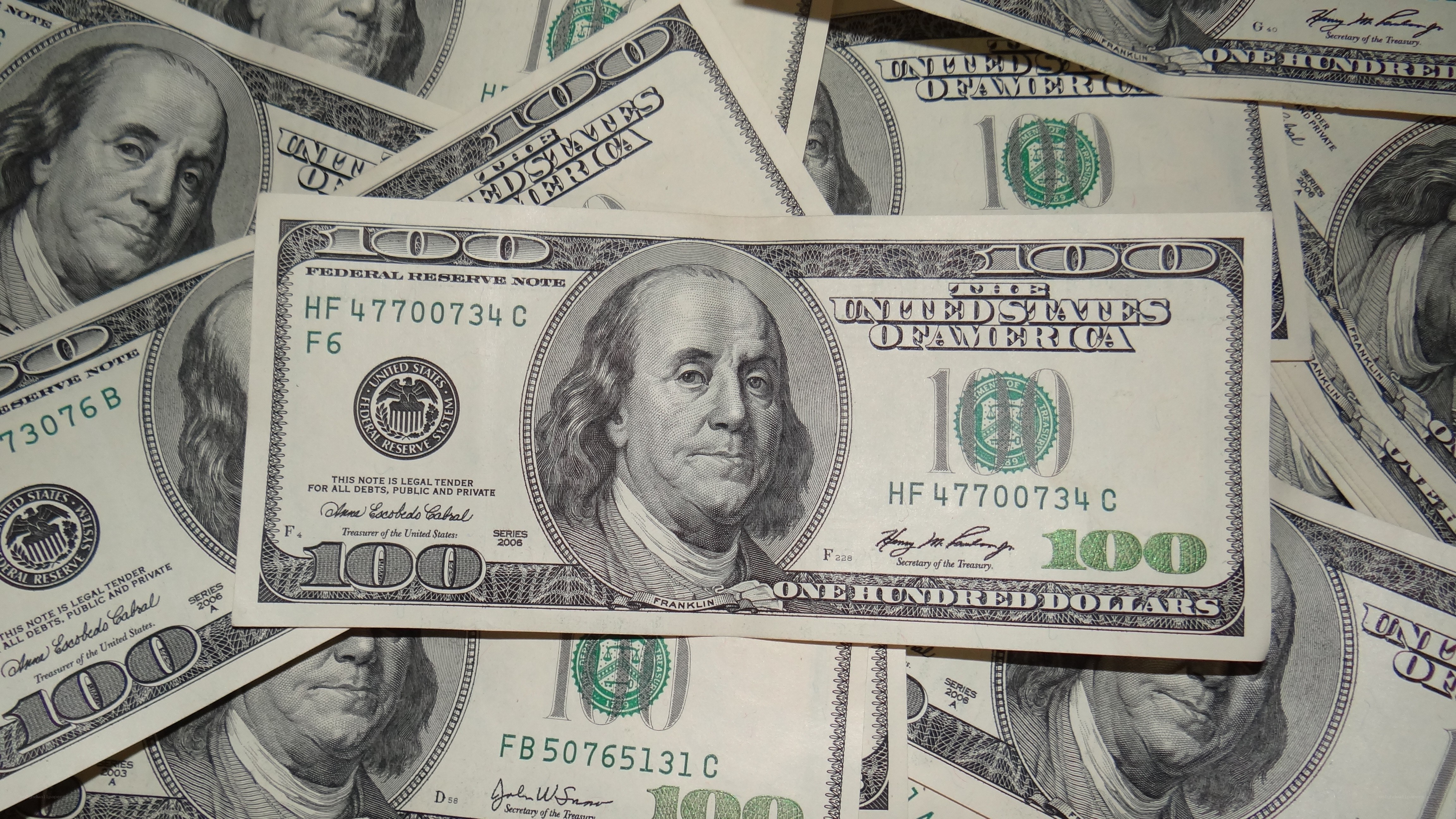 stack of hundred-dollar bills