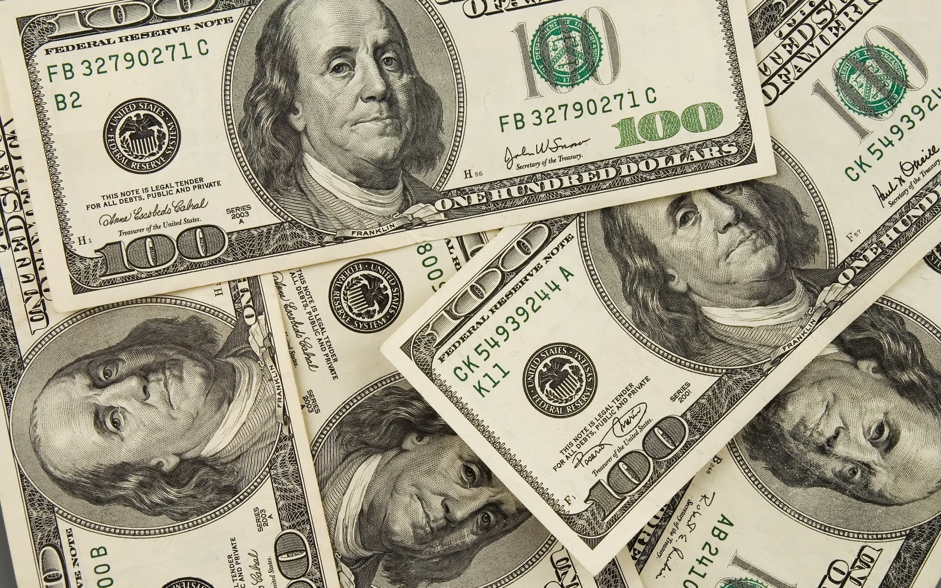 stack of hundred dollar bills