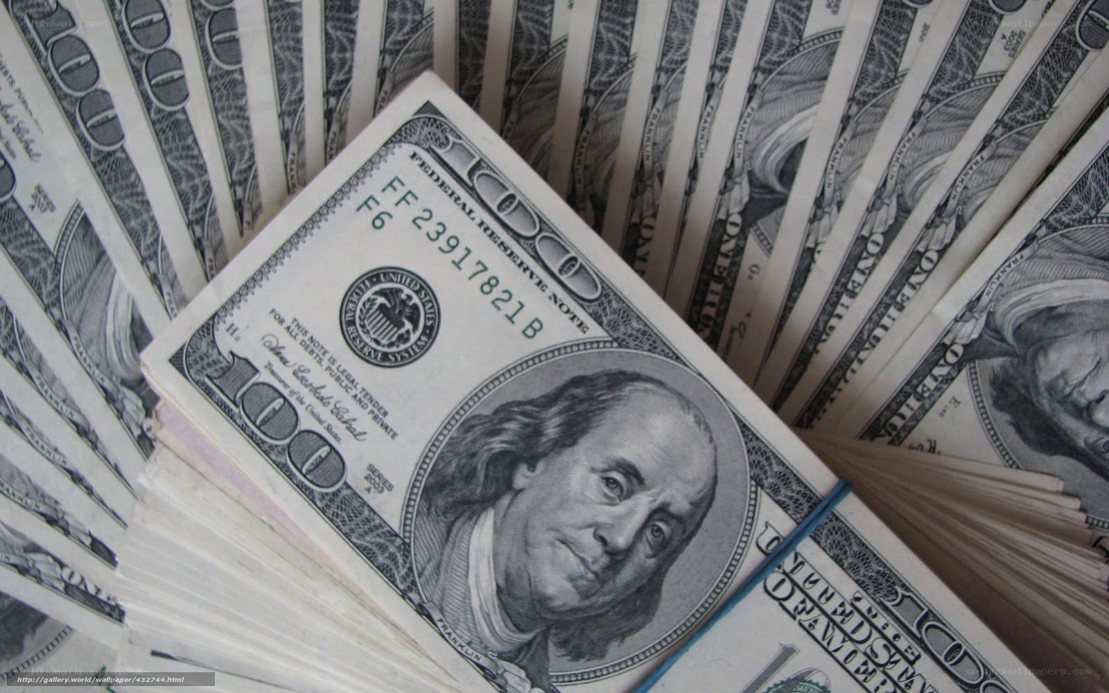 stack of hundred dollar bills