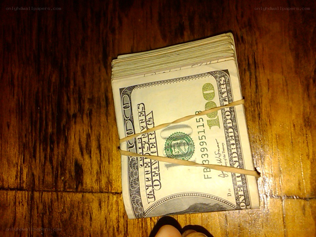 stack of hundred dollar bills