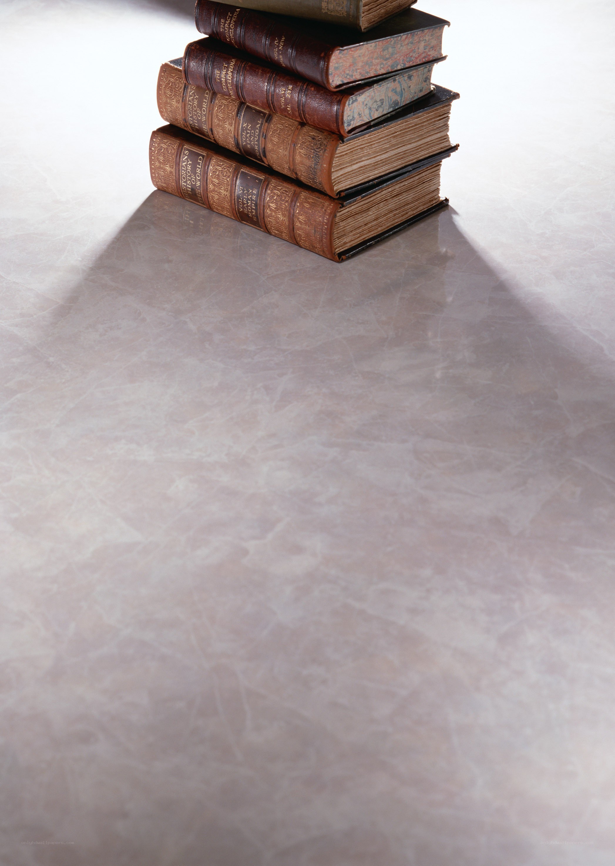 stack of old books on marble