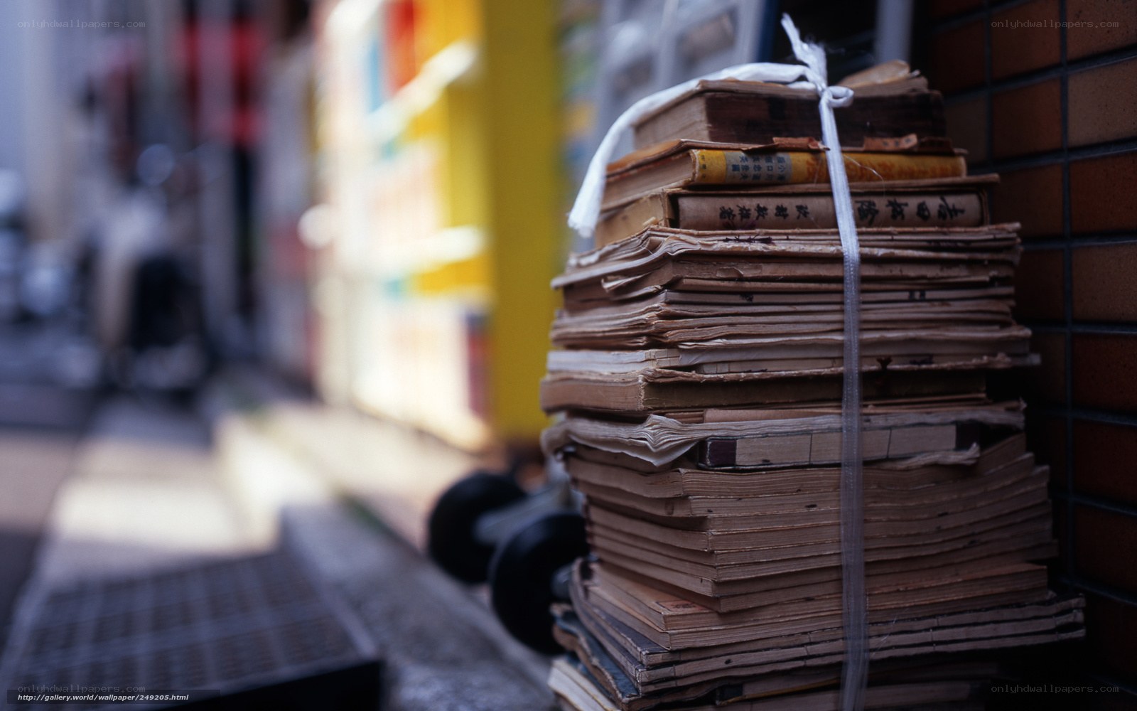 stack of old books on street