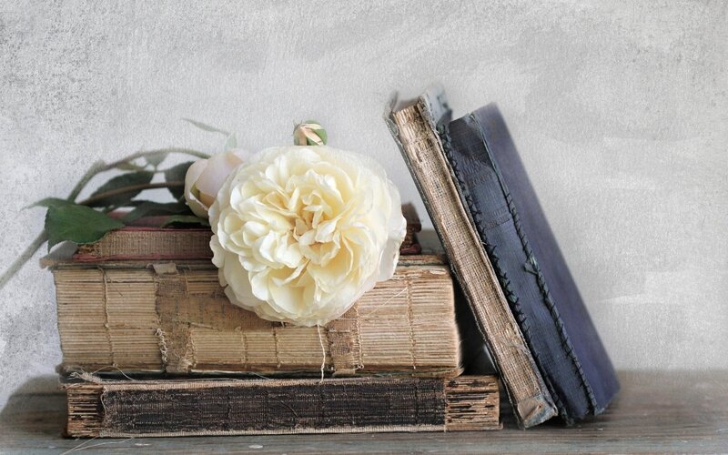 Stack of Old Books with Flower