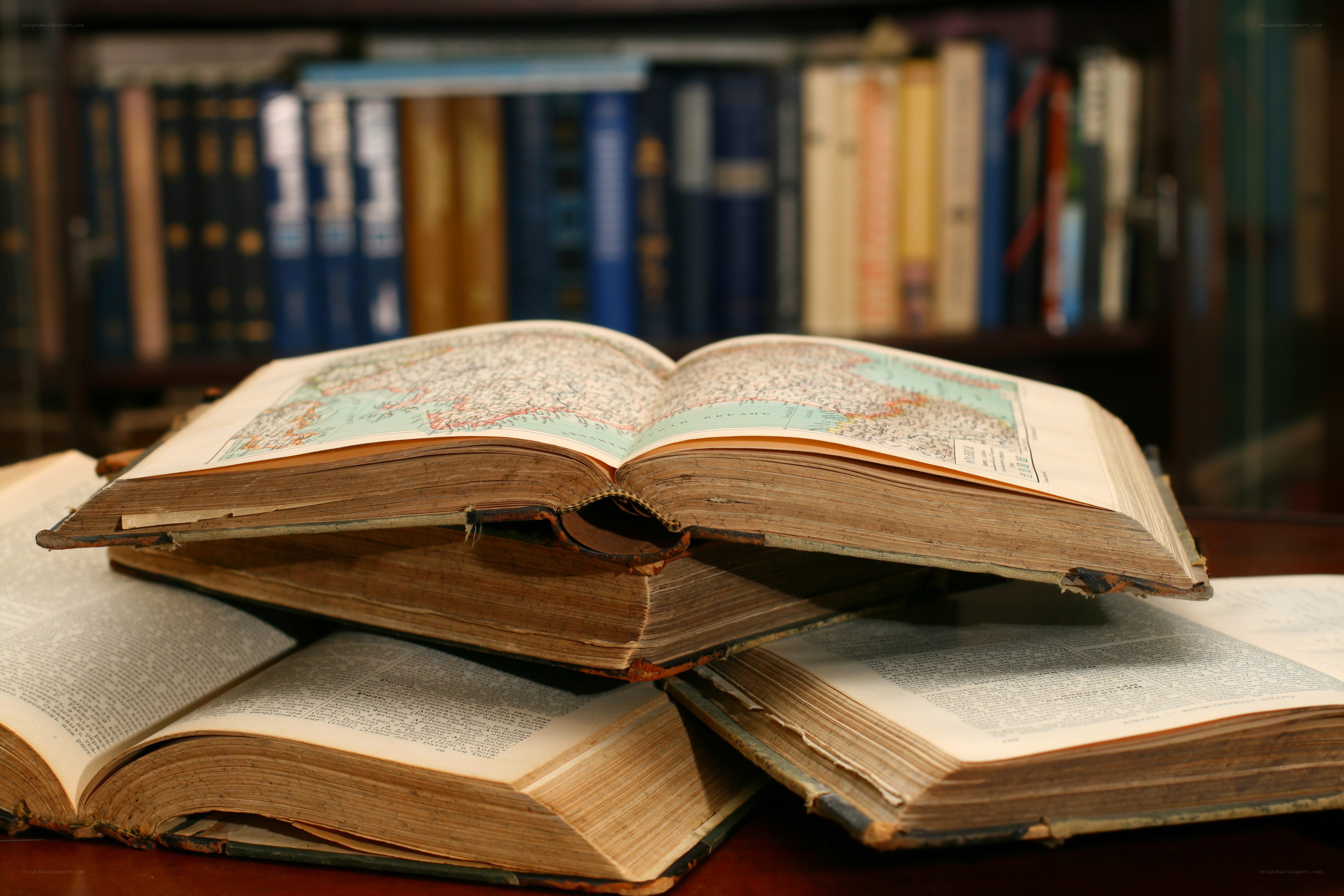 stack of old books with maps