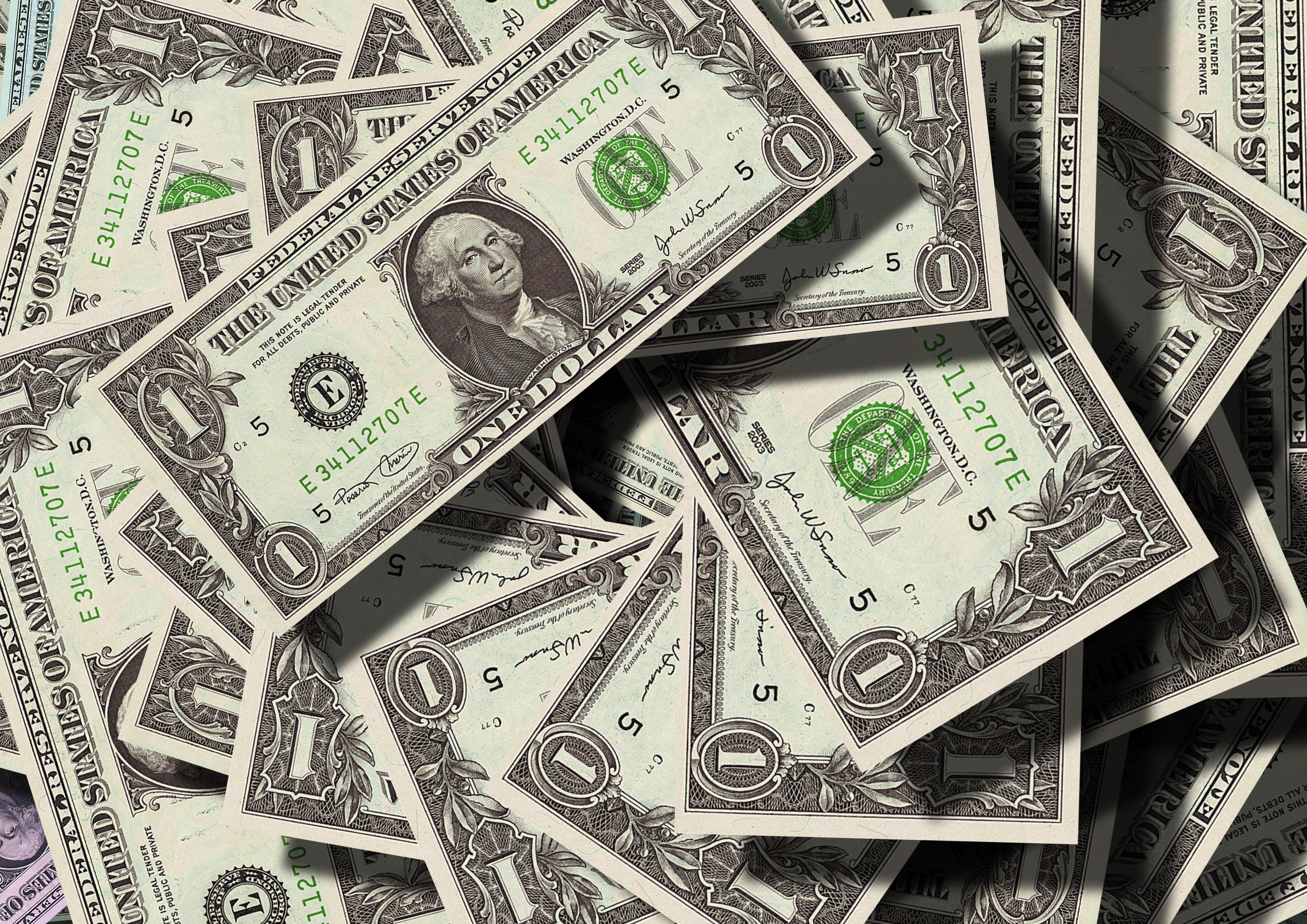 stack of one dollar bills