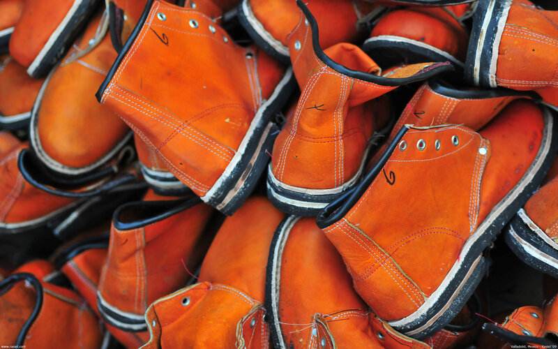 stack of orange work boots