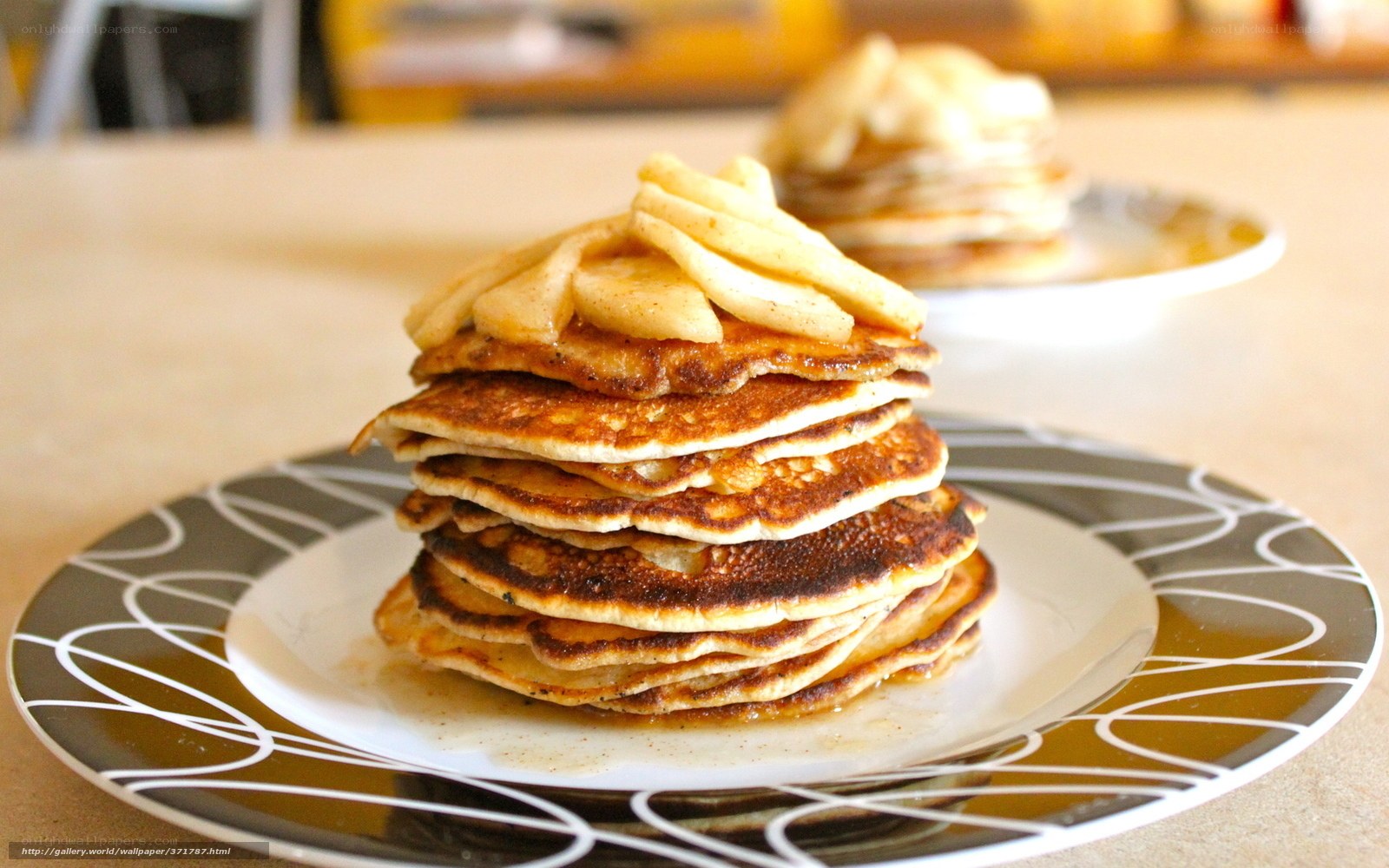 stack of pancakes with bananas