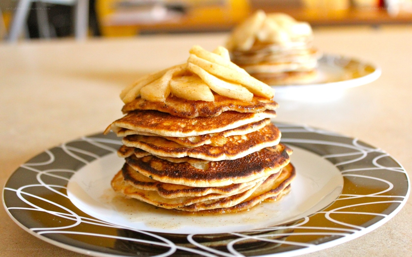 stack of pancakes with bananas