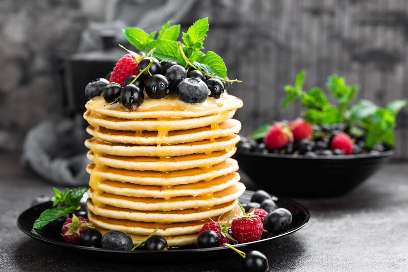 Stack of Pancakes with Berries — Black, Appetizing
