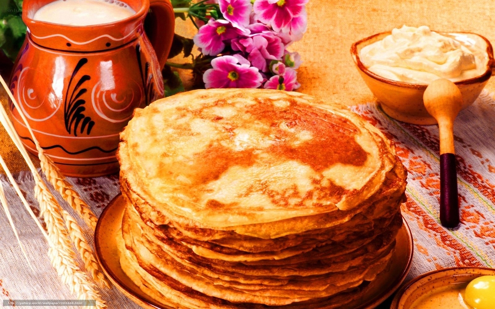 stack of pancakes with cream