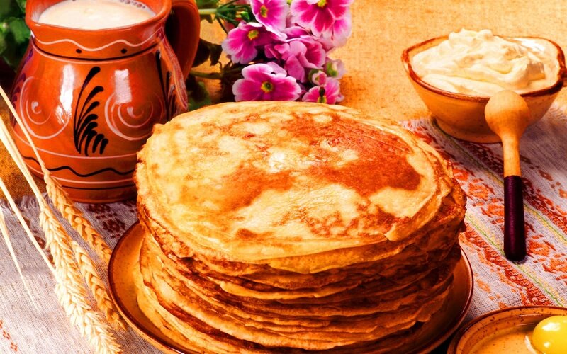 Stack of pancakes with cream