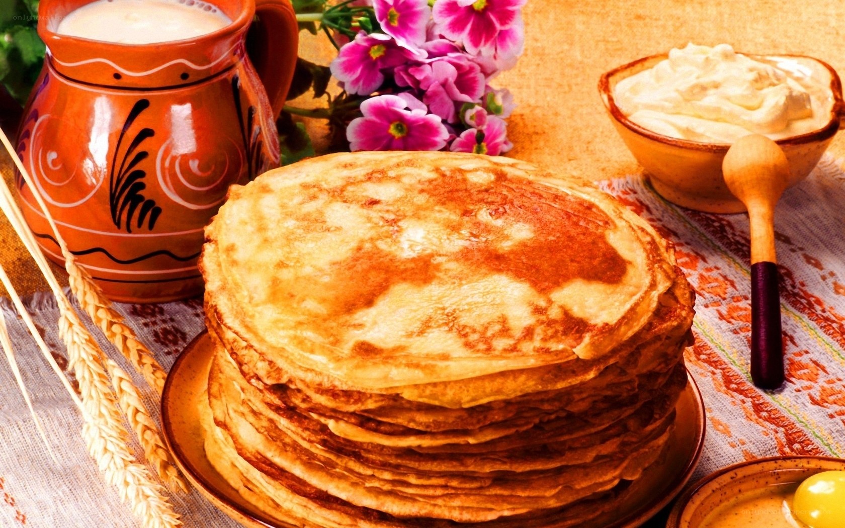 Stack of pancakes with cream