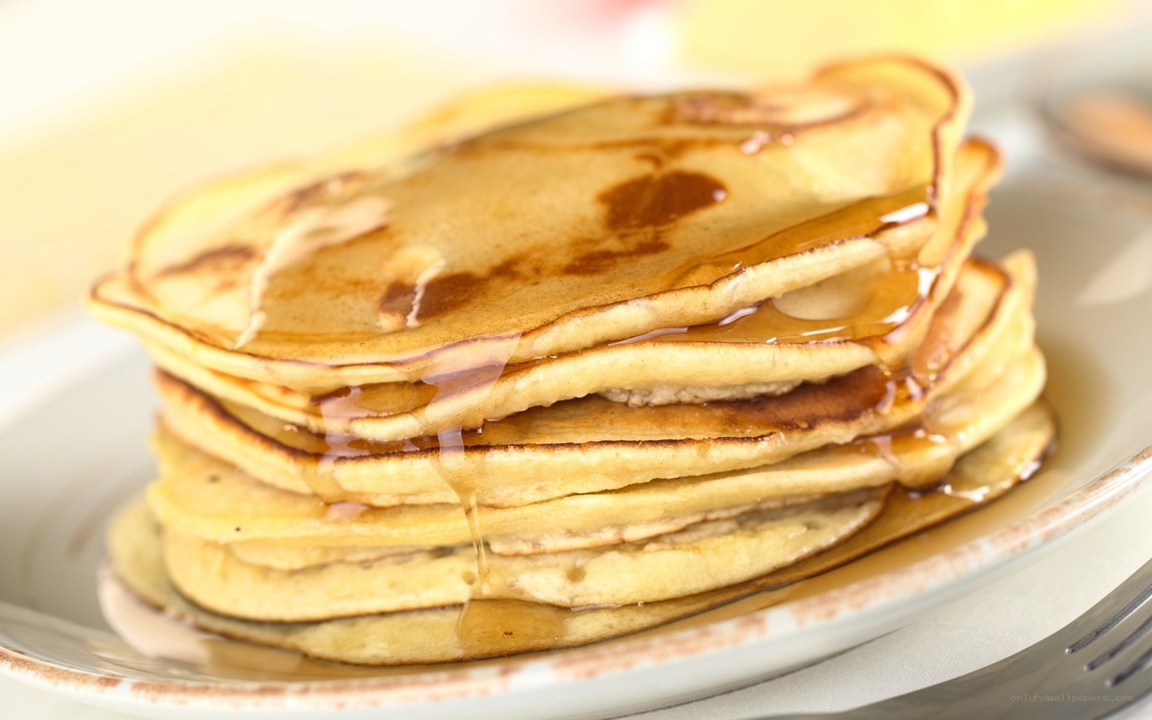 stack of pancakes with syrup