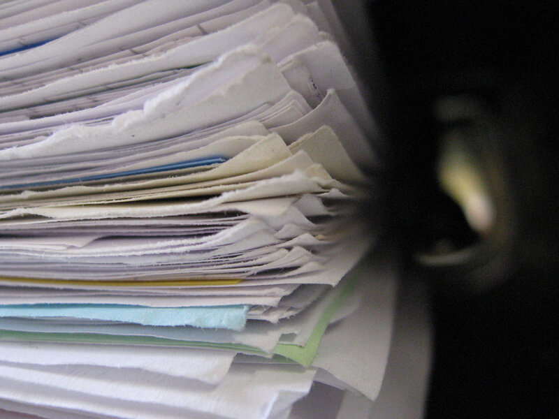 stack of papers in a binder