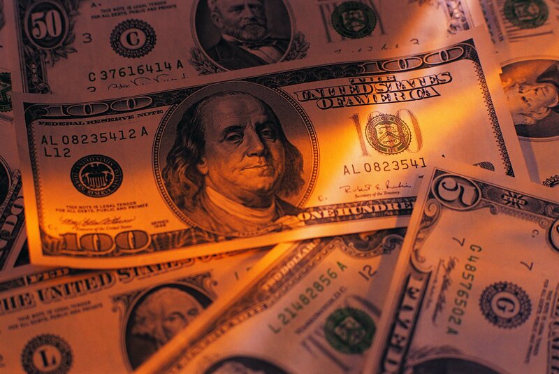 Stack of US Dollar Bills — Orange, Dramatic