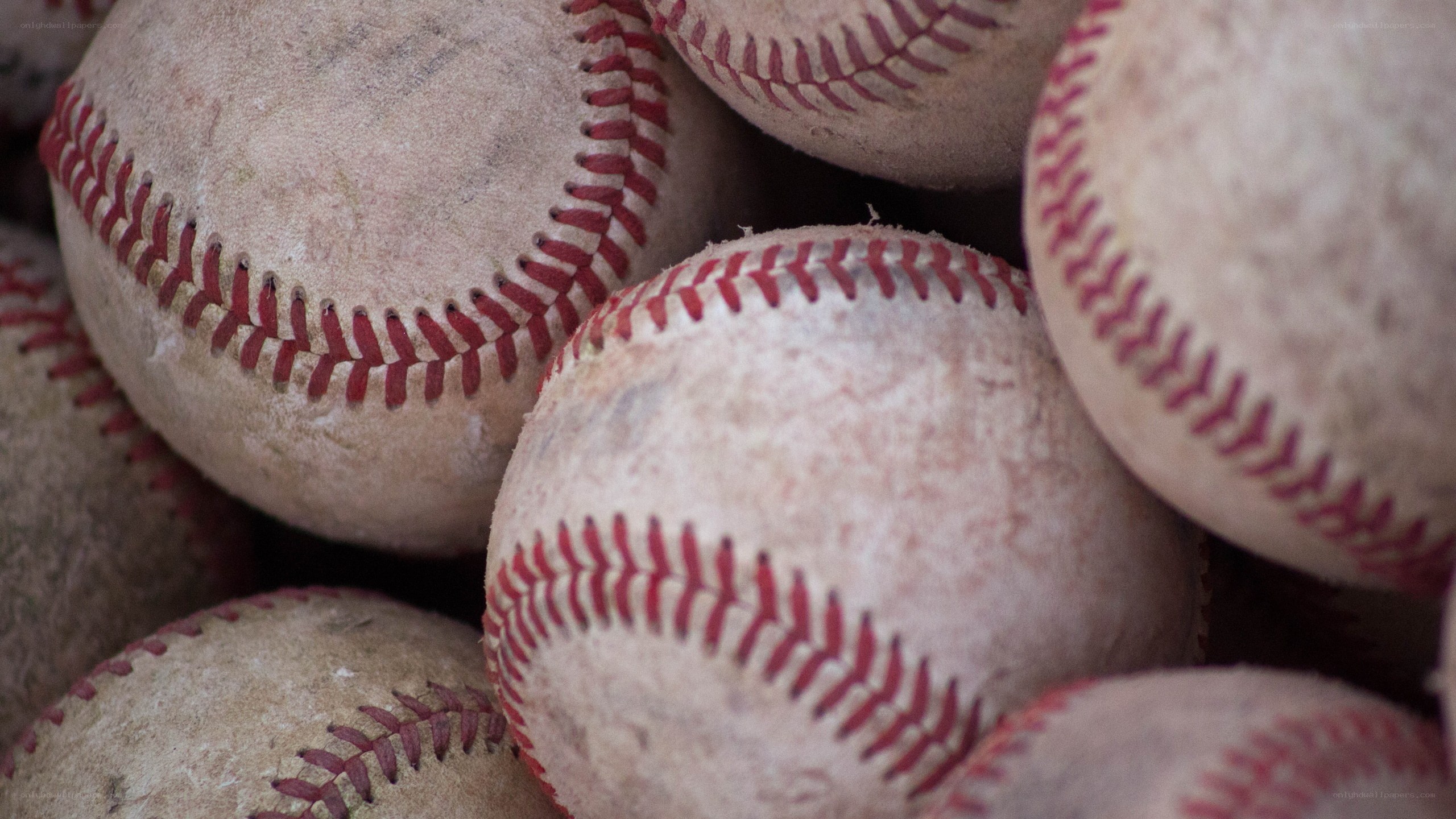 stack of used baseballs