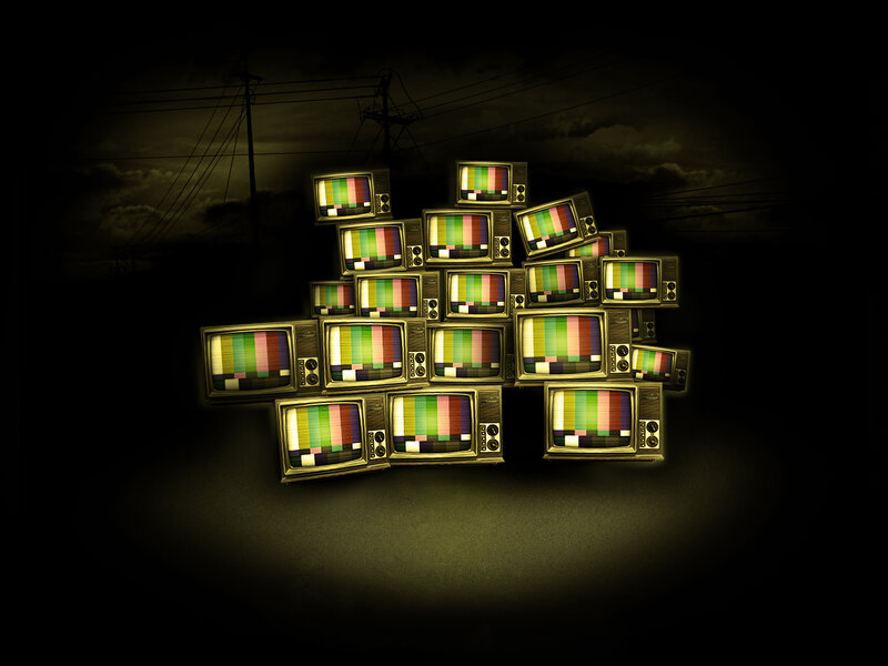 stack of vintage TVs with test patterns