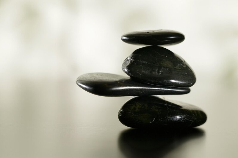 Stacked black stones