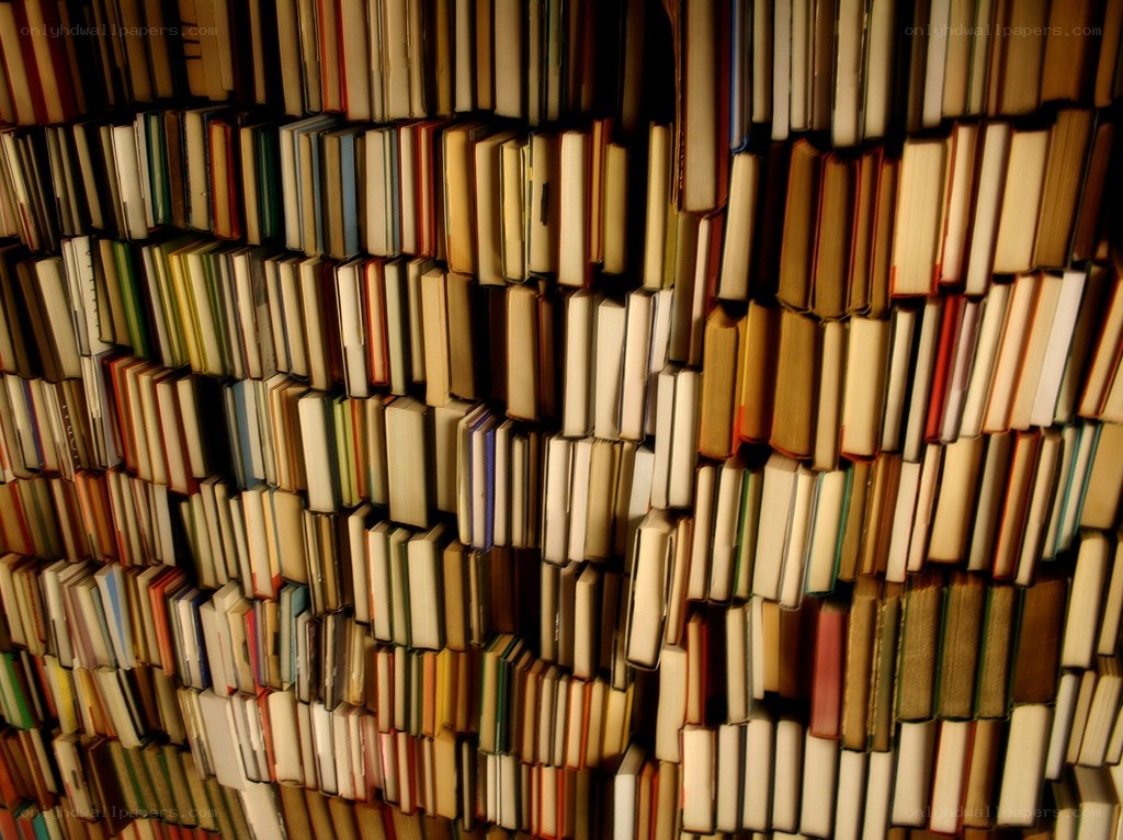 stacked books in a library